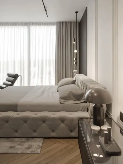 This angle shows the contrast between the dark accent wall and the classic white paneled walls, creating a balanced and sophisticated design.