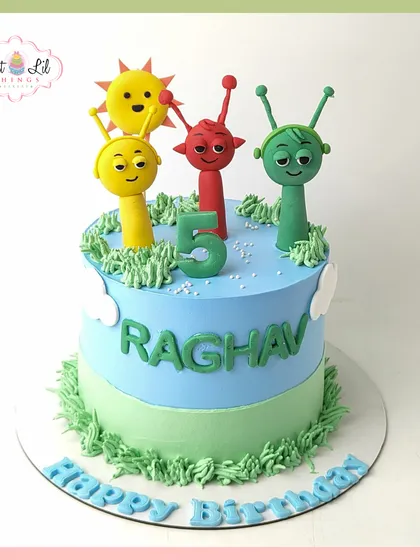 A bright and cheerful cake featuring characters from a popular kids' show. With a sunny sky and grassy field, this cake brings the cartoon world to life for a happy 5th birthday.