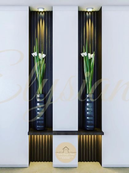 A modern foyer design with two tall niches featuring dark fluted panels and spotlights, creating a dramatic and elegant entrance.
