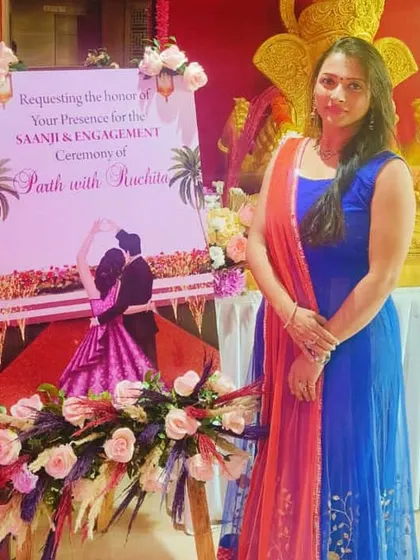 Standing by the welcome easel for Parth and Ruchita's Saanji and Engagement ceremony. The personalized signage is one of the first things guests see, setting the tone for a personal and elegant event.