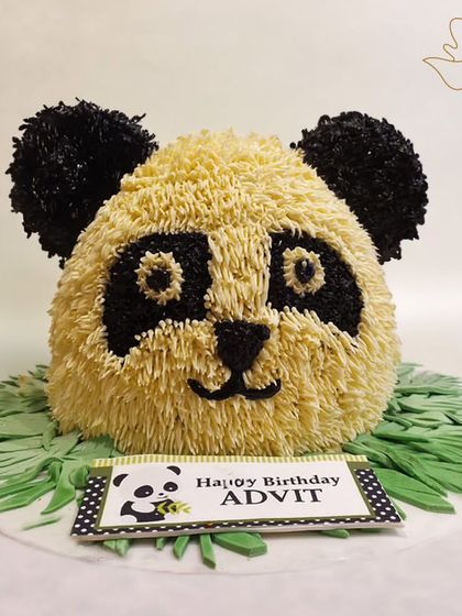 A furry and fun 3D panda head cake. The textured buttercream gives it a realistic, fluffy look, making it an impressive centerpiece for a panda lover's party.