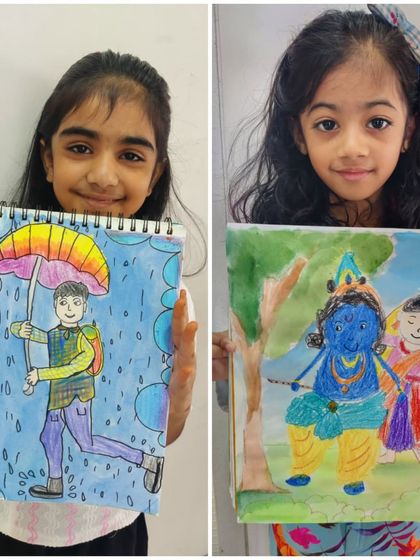 A showcase of storytelling through art. One girl drew a person walking in the rain under a rainbow umbrella, while the other depicted a classic scene of Krishna and Radha, both full of colour and life.
