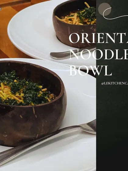 Our Oriental Noodle Bowl, served in a rustic coconut shell for an authentic and sustainable presentation.