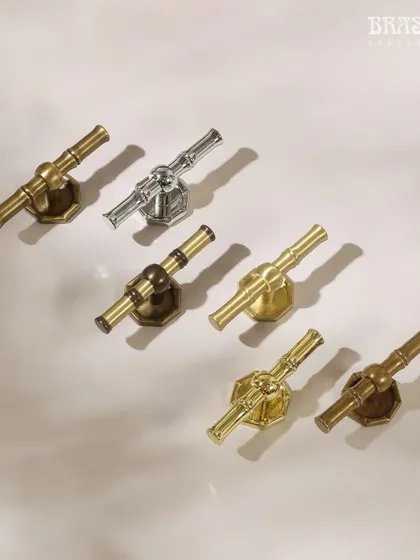The bamboo-inspired handle is available in all 32 of my signature finishes. This image displays a selection, from polished chrome to burnished brass, illustrating how the same design can be adapted to suit a variety of decor styles.