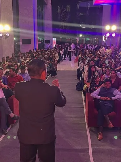 Performing for a huge audience at a corporate Diwali event is always an amazing experience. This shot shows me engaging with a crowd of hundreds, proving that my magic can fill even the biggest stages and bring everyone together for a shared moment of wonder.