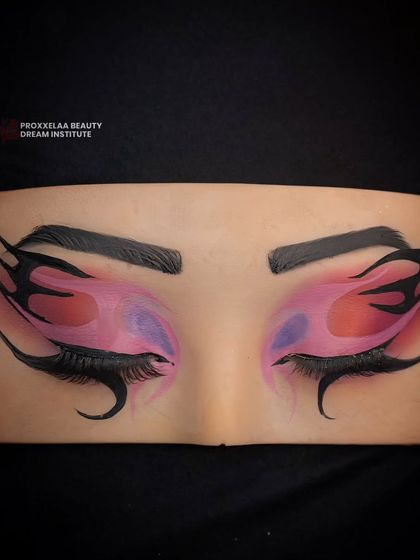 Creating mesmerizing eyes with a perfect blend of colors. This eye board shows a fiery, graphic liner look with pink and purple hues.