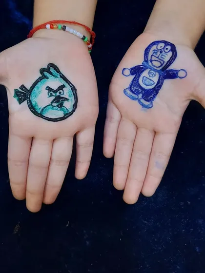 Sometimes the cutest requests come from my youngest clients. Here's a fun design featuring Angry Birds and Doraemon, done with safe, non-toxic colored ink.