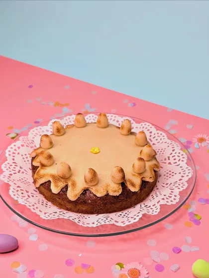 This is my take on the classic English Simnel Cake for Easter. It's a rich, spiced fruit cake layered and topped with toasted almond marzipan, a traditional treat that I love recreating.