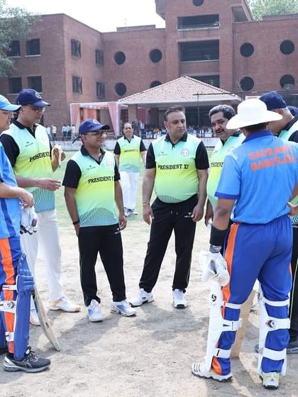 A strategic discussion on the field during the exhibition match. The game was played in a friendly and spirited environment, which is the true win.