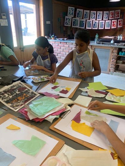 Students in a collagraphy module work on their plates, using collage techniques with different papers and textures. This preparation stage is where the foundation for the final print's unique look is built.
