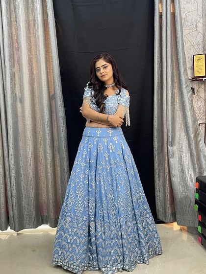 This shot shows the full outfit in a studio setting, highlighting its elegant color and design.