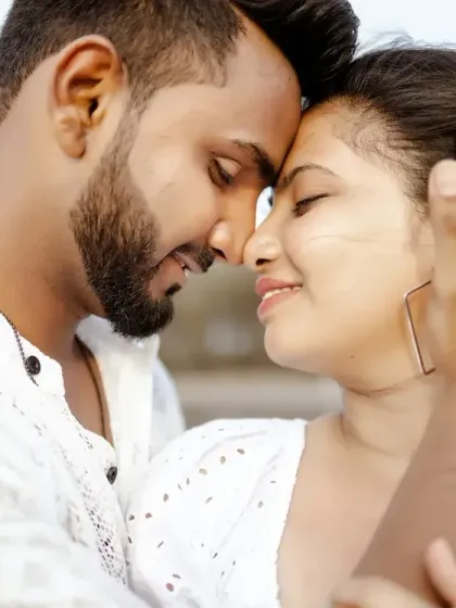 A close-up shot capturing the deep connection between the couple. The soft focus and natural light make this a beautifully romantic pre-wedding portrait.