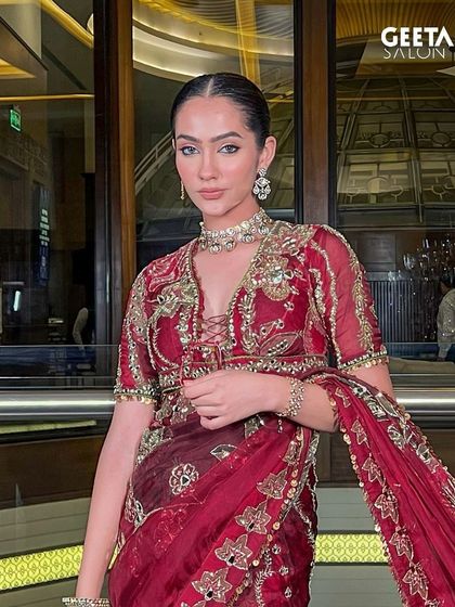 A frontal view of this classic bridal look, showcasing the flawless skin work and defined eyes that radiate sophistication.