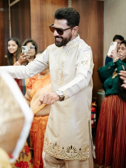 The groom's entrance, dancing his way into the Haldi celebration. We ensure the energy is high from the very first moment.