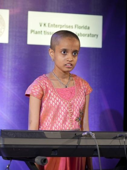 A student keyboardist performing with heartfelt expression at Kalaa Sangama.