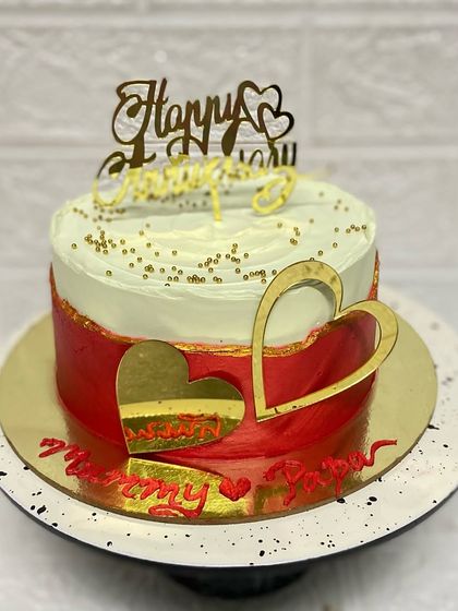 Our anniversary special red and white vanilla cake, decorated with golden hearts.