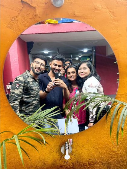 A duplicate of a mirror selfie with the group. A creative way to capture the moment.