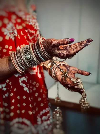 It's all in the details. A close-up of the bride's hands, showing her beautiful henna, bangles, and kalire, which are all part of the complete bridal look I help style.