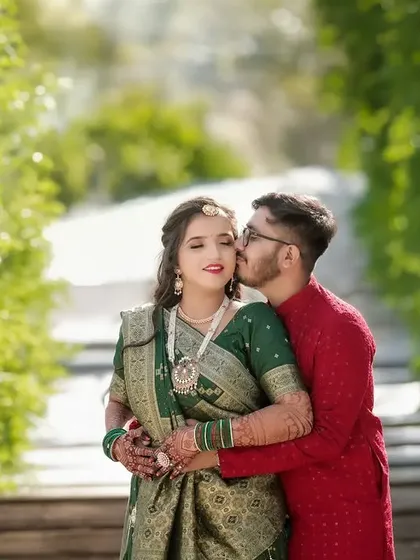A quiet moment of affection amidst a beautiful landscape. For pre-wedding shoots, I focus on capturing your natural connection, like this gentle kiss on the cheek, creating romantic and relaxed couple portraits.