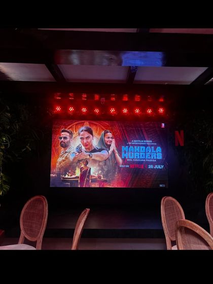 The screen is ready for the trailer reveal at the 'Mandala Murders' launch. We manage all content playback.