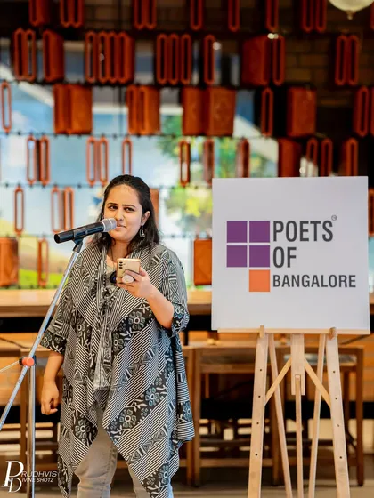 A performer at our "Wheel of Life" themed event. This theme inspired poets to reflect on life's cycles, challenges, and transformations.