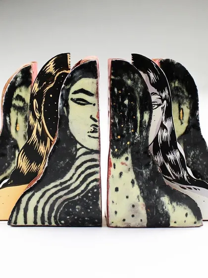 A duplicate image of the side view of the 'Confrontation' pieces.