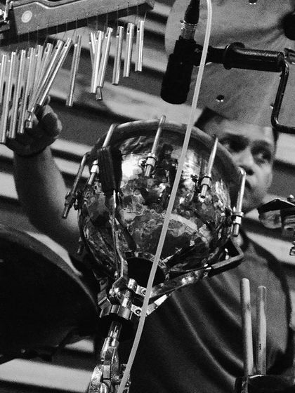 The intricate setup of our percussionist's rig in the studio. This black and white photo shows the complexity and variety of sounds he brings to the music.