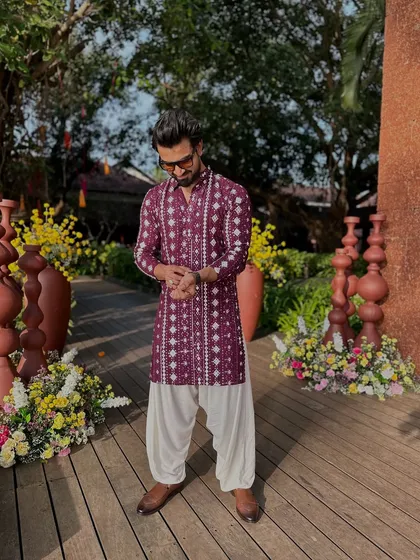 Let's bring some new colors to life. This maroon kurta adds a touch of richness and is perfect for a festive occasion.