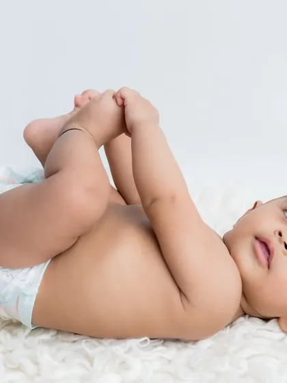 Grabbing those tiny toes! This is such a classic and cute baby pose that I love to capture.