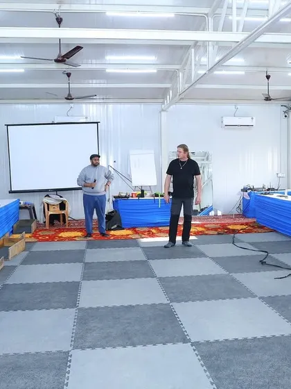 My mentor and I listening to insights from international expert Jurgen 'Jogi' Zank. Continuous learning is a non-negotiable part of being a top-tier trainer.