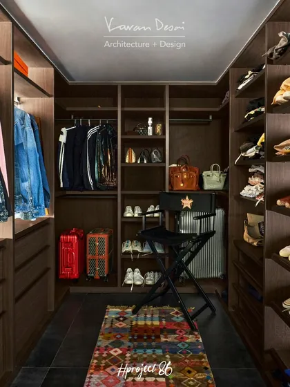 The walk-in wardrobe in Project 86 was meticulously designed to house the client's entire collection. Every shelf and drawer was customized for specific items, from shoes and bags to luggage.