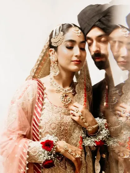 An artistic portrait using in-camera blur and layering. This technique creates a soft, dreamy, and ethereal image that focuses on the quiet, emotional connection between the bride and groom.