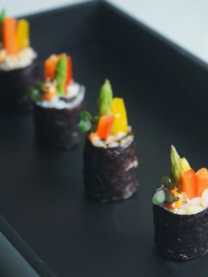 Vegetarian sushi rolls filled with crisp asparagus and colorful bell peppers. These are a popular choice for guests looking for a light, healthy, and flavorful canapé option.