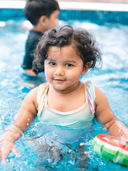 A happy splash in the pool. I'm available for on-location shoots in Bangalore to capture your family's fun and candid moments.