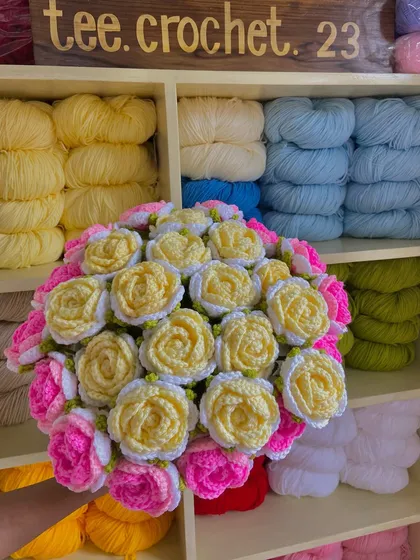 Another custom rose bouquet, this one featuring yellow, white, and pink blooms.