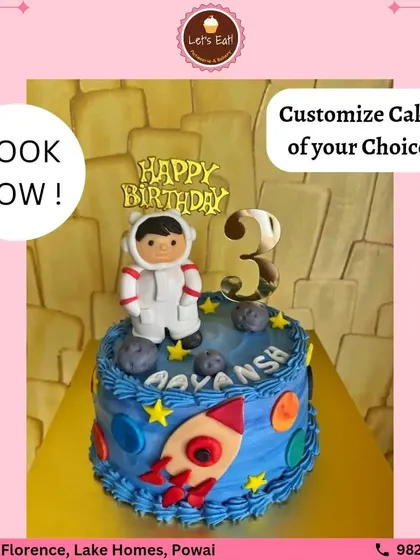 A space-themed cake perfect for a little astronaut's third birthday. The design features planets, stars, a rocket, and a fondant astronaut, turning a simple cake into an out-of-this-world adventure.
