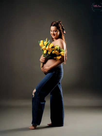 A sweet and simple portrait, using a bouquet of yellow tulips to add a pop of color and a touch of nature.