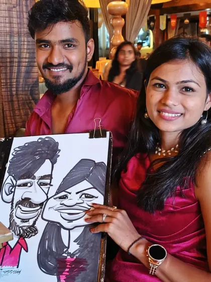 A couple from the Coleda team with their joint caricature. It's a fun memento for work friends and couples.
