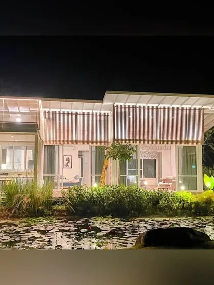 The home's expansive glass walls create a direct visual connection to the lily pond. From inside, it feels as though the house is floating on the water, fully immersed in the natural landscape we created.