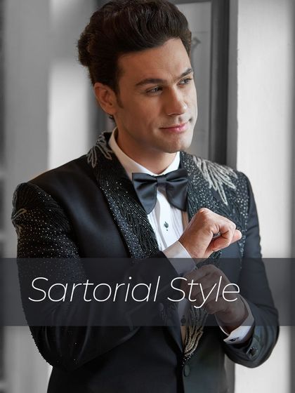 Sartorial style is all about the details. This image captures a gentleman adjusting his cuff in an exquisitely embroidered tuxedo, a hallmark of my bespoke occasion wear.