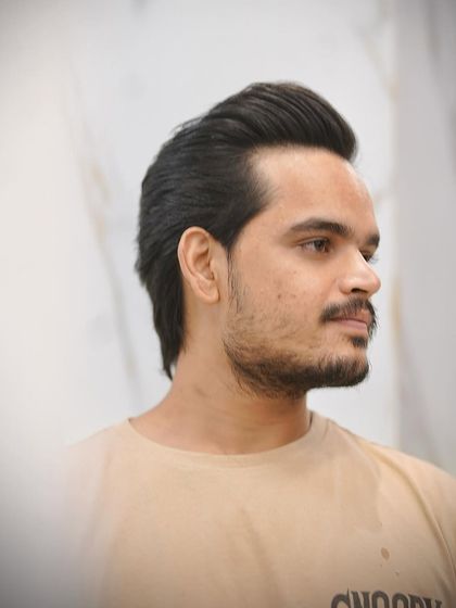 Another look at the wolf cut, showing how it frames the face. It's a versatile cut that can be styled in different ways for different occasions.