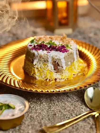 My Chicken Malai Biryani is a crowd-pleaser, known for being low on spice but incredibly high on flavor. It features tender chicken and fragrant basmati rice, slow-cooked with cream and subtle spices, then garnished with rose petals for an elegant touch.