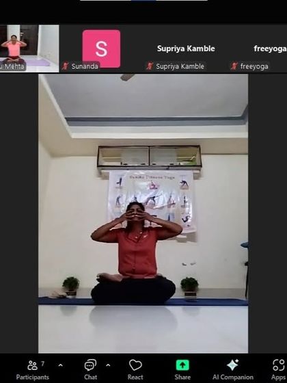 An instructor demonstrates Bhramari Pranayama in the digestive health workshop. This practice helps to reduce stress, which is a common cause of digestive issues.