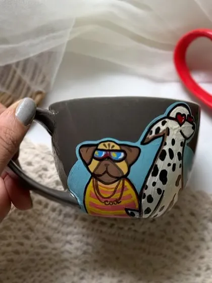 A close-up of the grey 'Cool Crew' mug, showing the pug with sunglasses and the dalmatian.