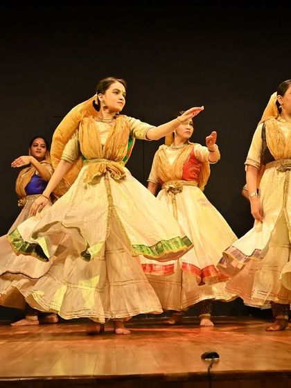 My ensemble in a graceful, synchronized pose. This image highlights the elegance and coordination of a traditional group Kathak performance.