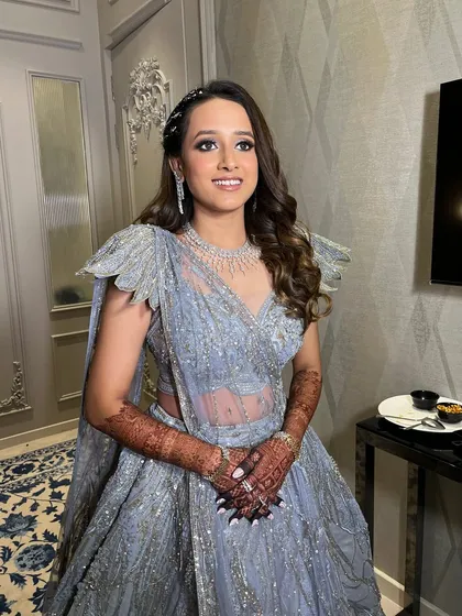 Tanvi looking absolutely stunning and ready for her Sangeet. The combination of glittery eyes, soft curls, and a diamond necklace is pure elegance.