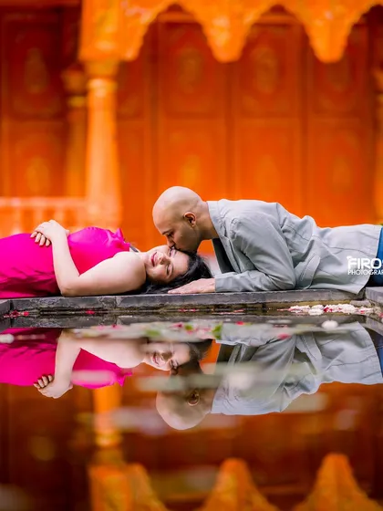 This is one of my favorite creative shots, using a water reflection to create a serene and artistic maternity portrait. The gentle kiss and the perfect reflection in the water capture a quiet, intimate moment between the couple.