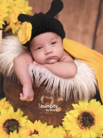 How cute is this little bumblebee. A creative twist on the sunflower theme, this shot adds a touch of whimsy and fun to the newborn session.