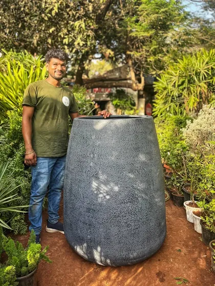 When you want to make a huge statement, do it with an oversized planter. This giant pot, with its textured grey finish, is waiting for an equally impressive plant to call it home.