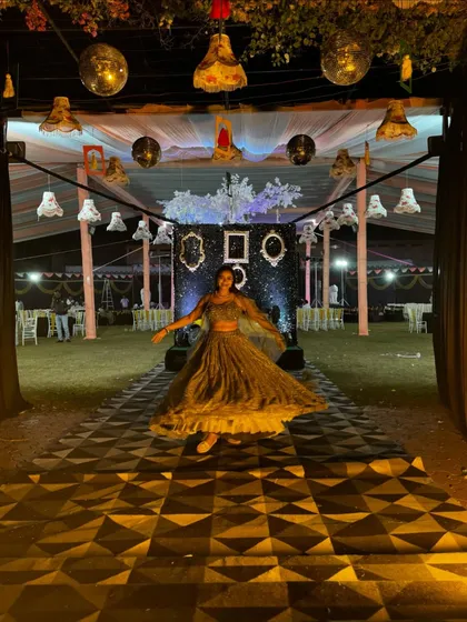 A wide shot showing the grand entrance and walkway for the 'Glitz and Glam' Sangeet night.